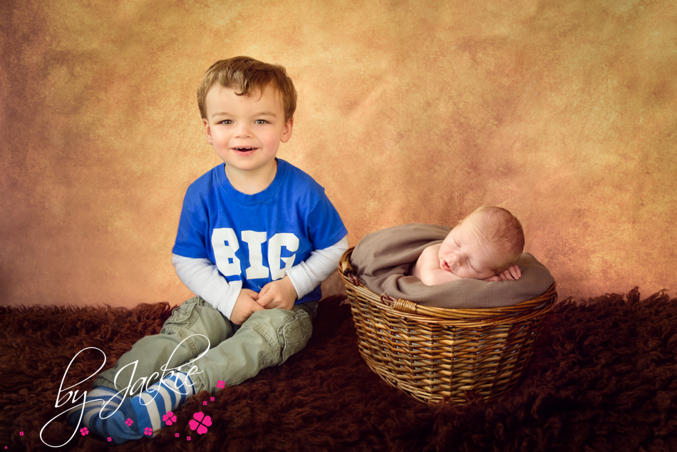 Little boy with his newborn baby brother by Babies By Jackie near Malton, York