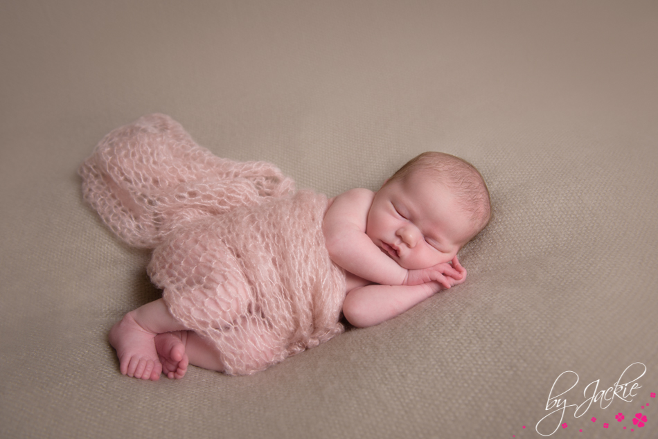 baby asleep on beige mohair blanket and wrapped in pink mohair by Babies By Jackie near York