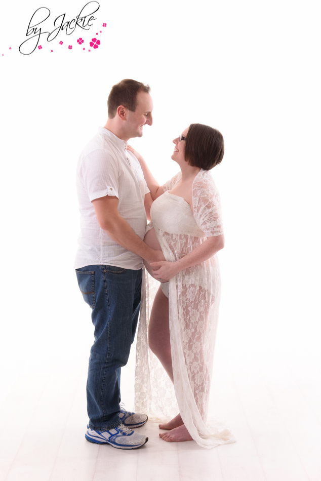 husband and wife facing each other for maternity photograph. image by Babies By Jackie Selby Yorkshire