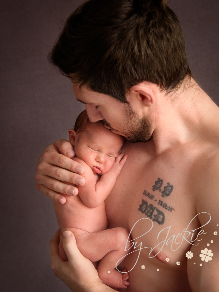 Dad holding his newborn baby boy by Babies by Jackie, near York, Hull, Pocklington and Beverley, Yorkshire UK