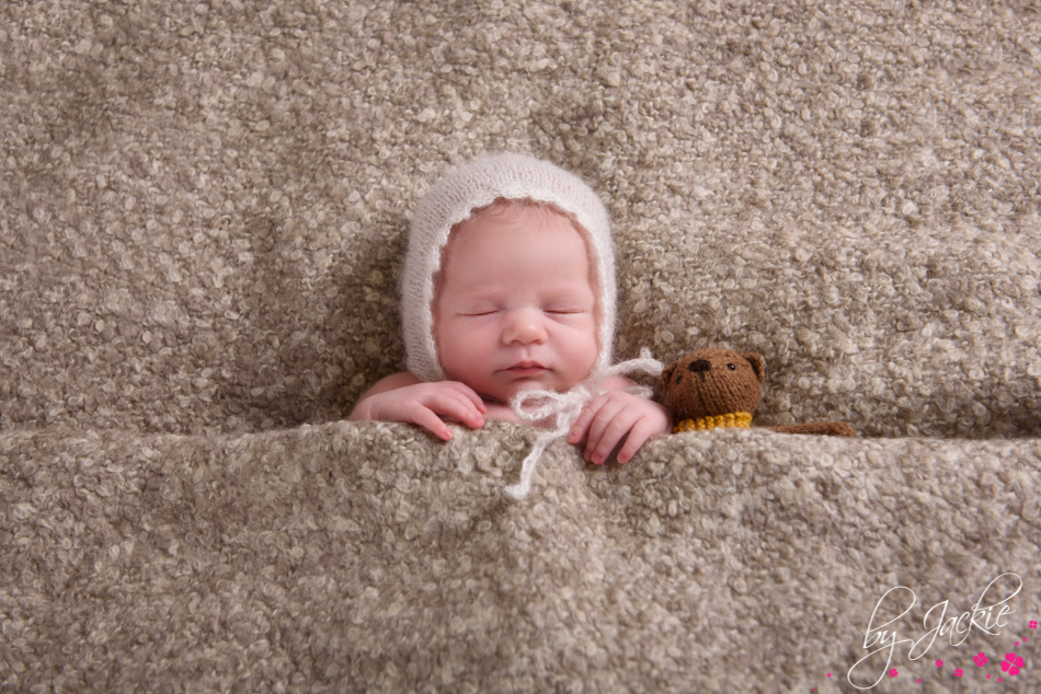 baby girl snuggled in bed with teddy. image by babies by jackie between York and Howden