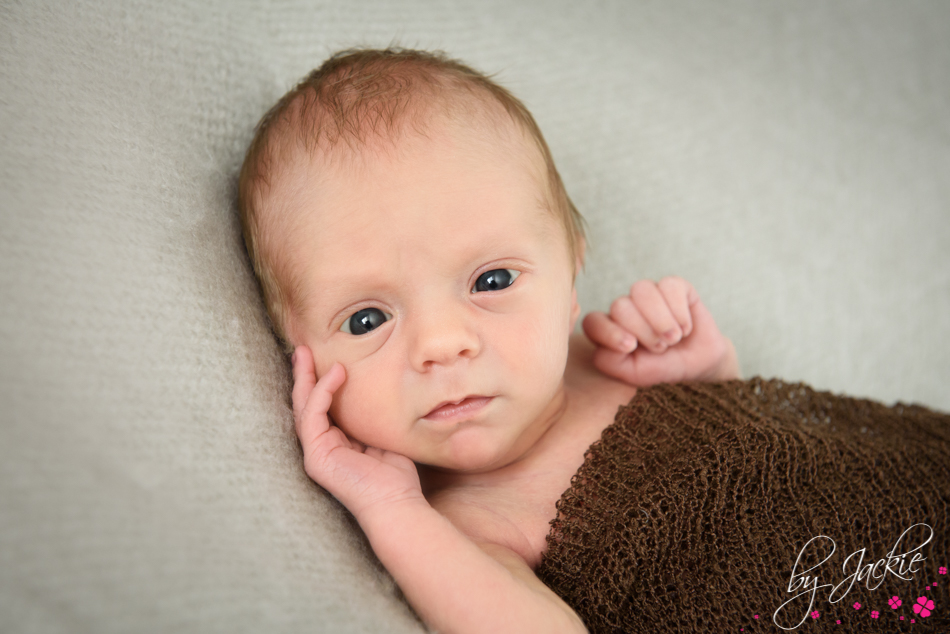 Newborn baby boy awake and looking at the camera. Babies By Jackie, York, Selby, Howden