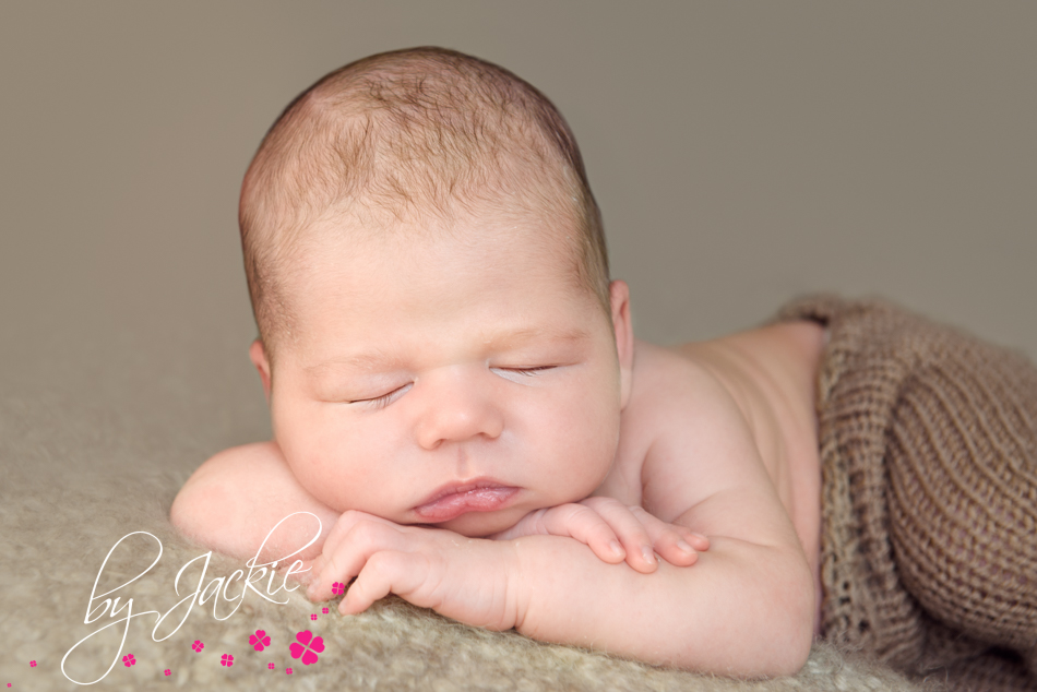 Newborn baby boy chin on hands image by Jackie Photography, York, Yorkshire, UK
