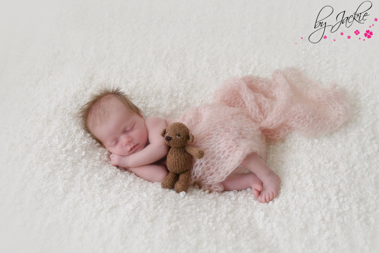 Image of newborn baby girl in pink mohair wrap with teddy bear By Jackie Photography York, North Yorkshire