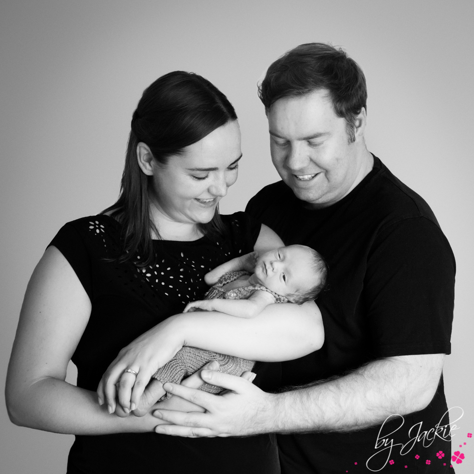 Mum and dad with their newborn baby boy. Monochrome image by Babies By Jackie in Yorkshire UK