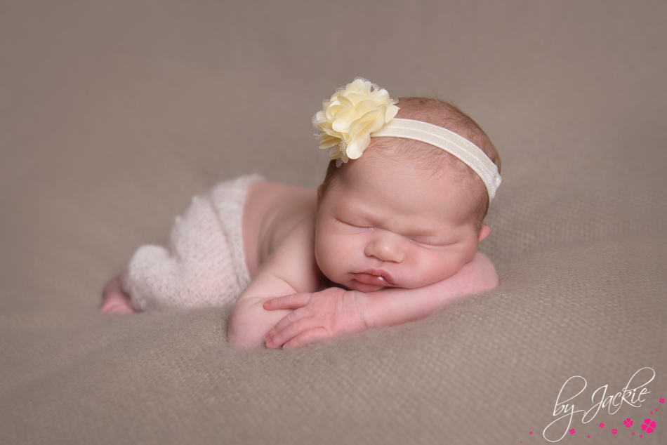 newborn baby girl asleep with head on hands, photo by Babies By Jackie near York