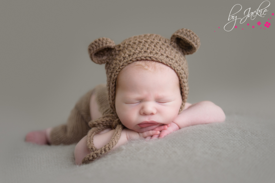 newborn baby boy wearing teddy bear ears hat by jackie photography yorkshire uk