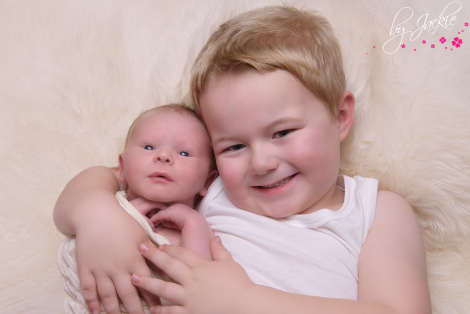 little boy with his new baby brother by jackie uk yorkshire