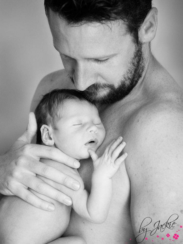 Black and white photo of daddy with his newborn baby boy in North Yorkshire Image by Babies By Jackie near York, Howden and Selby