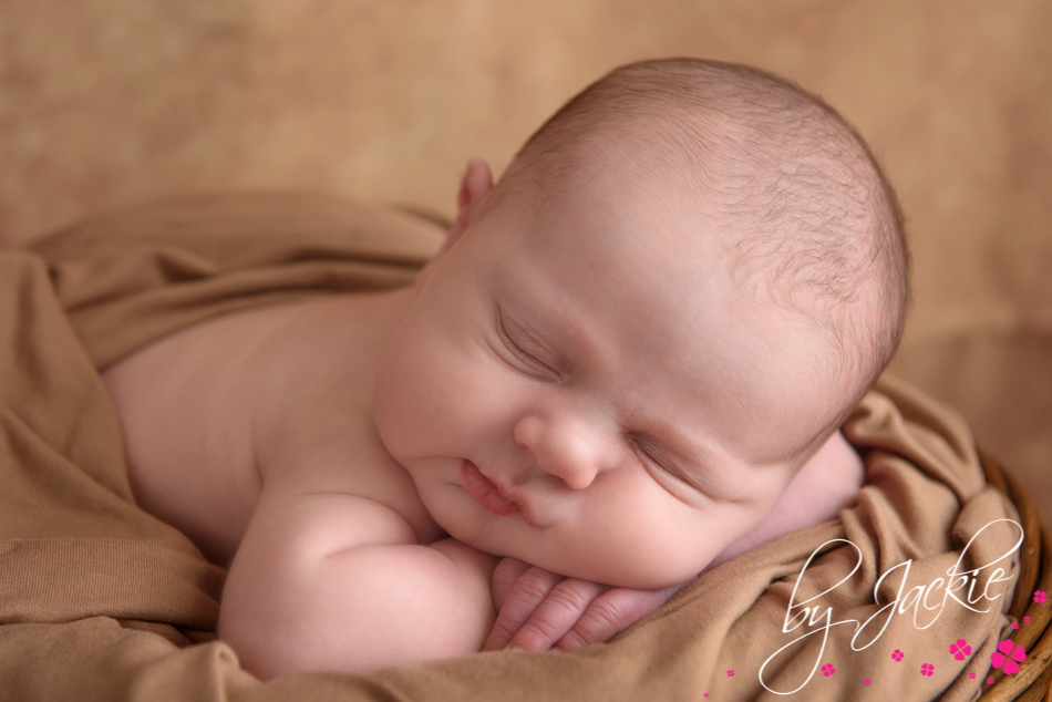 Photography of sleeping newborn baby boy in a basket by Babies By Jackie near York, Selby and Goole, UK