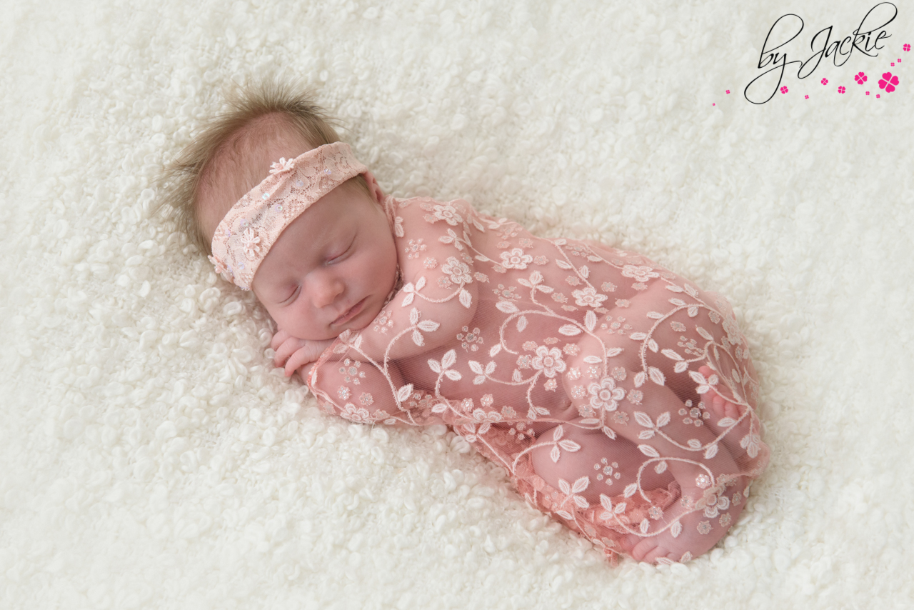 Image of newborn baby girl wrapped in pink lace near York, Photo By Jackie