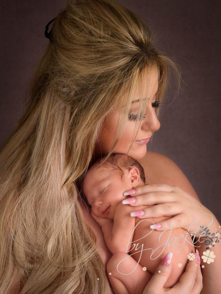 Mum holding her newborn baby boy by Babies by Jackie, Market Weighton, near York, Hull and Pocklington, Yorkshire UK